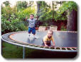 Jaedin and Cam playing on the trampoline