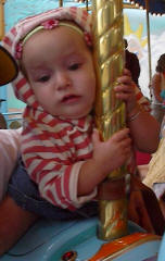 Holding on for dear life on the carousel