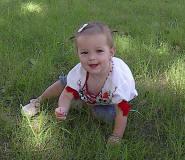 Addie playing in the grass