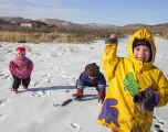 3kids20031215snowballthrow.jpg (107077 bytes)